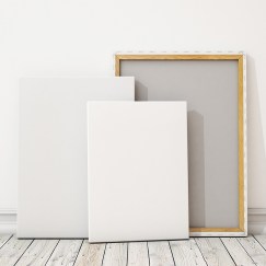 blank canvas or poster with pile of canvas on floor and wall